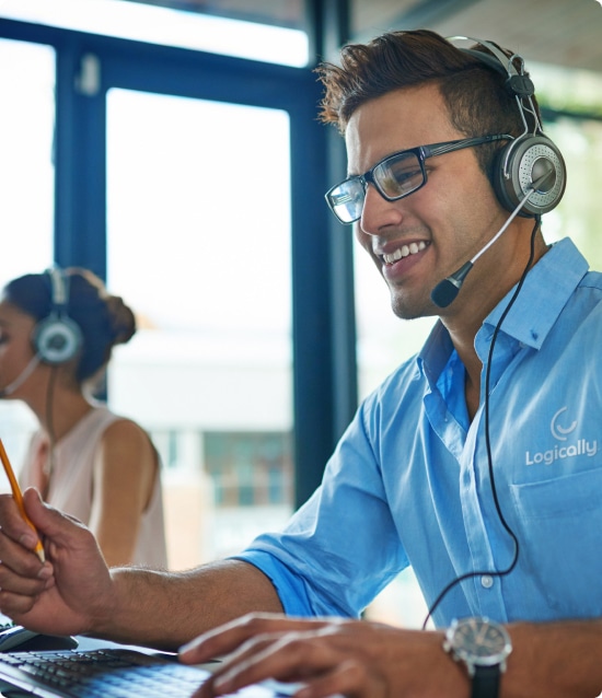 Woman and man with headsets talking to customers