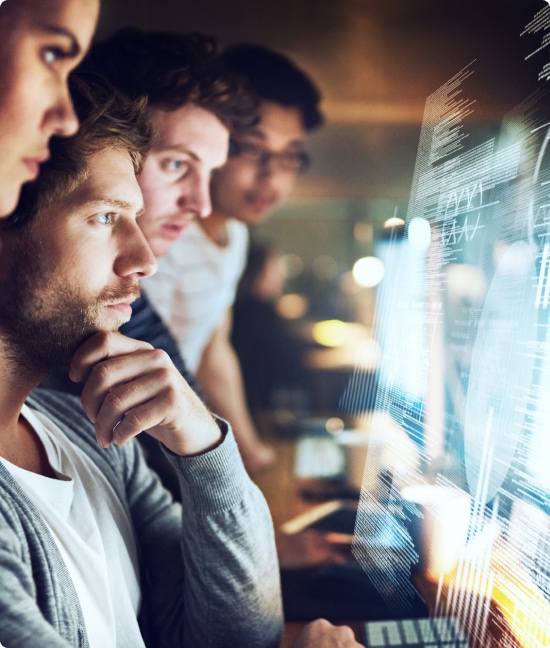 Group of people looking at a computer screen