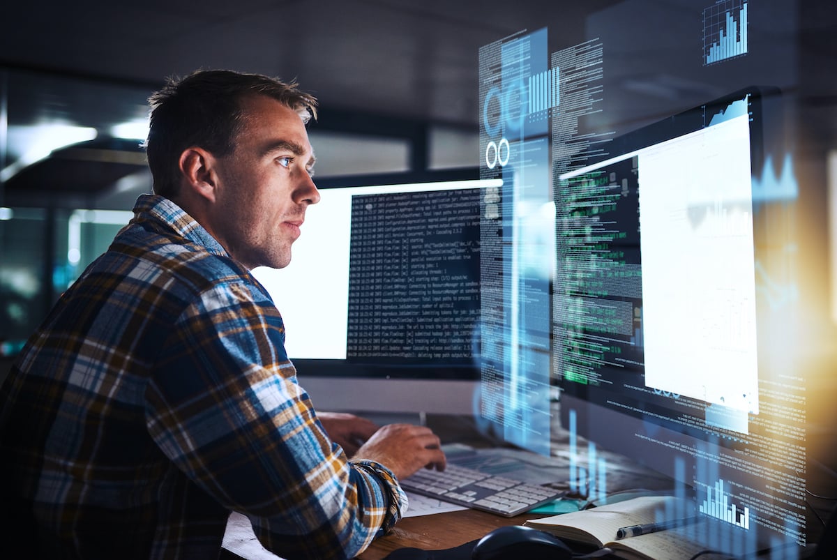 Concentrated man working on a computer