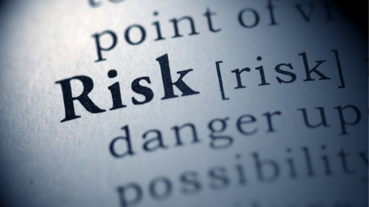 image of risk on a dictionary in focus