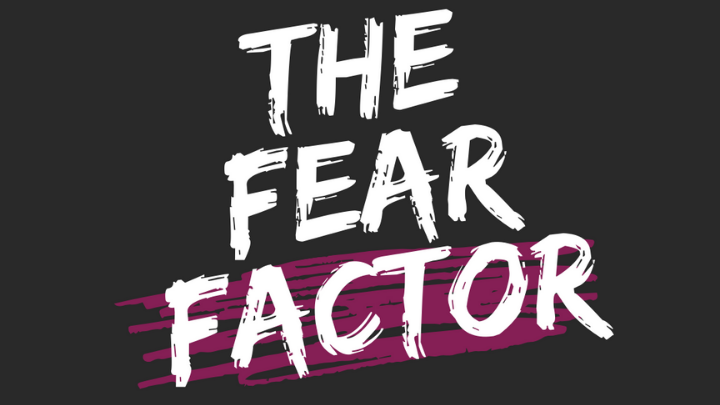 image of the fear factor text with paint style on a black background