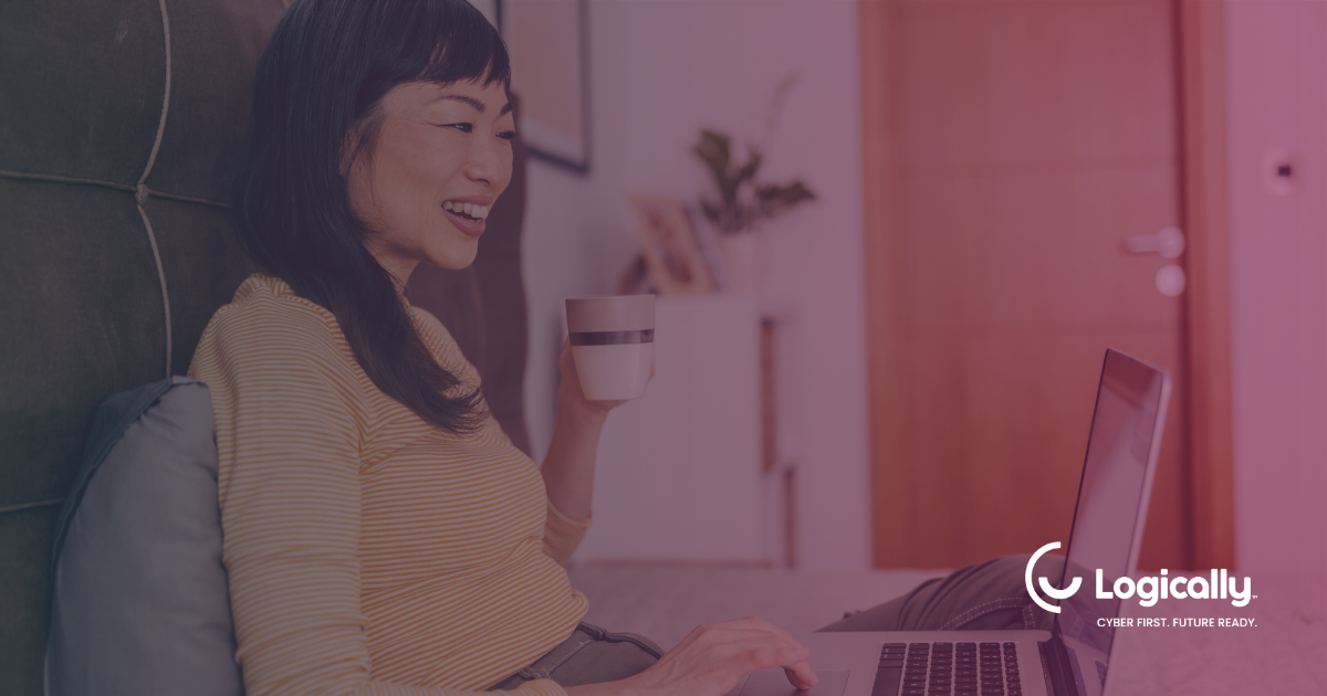 smiling tech professional using laptop for microsoft co-pilot